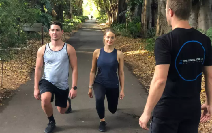 clients performing lunges in the Adelaide Botanic Garden