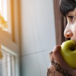 Lady Eating and Apple